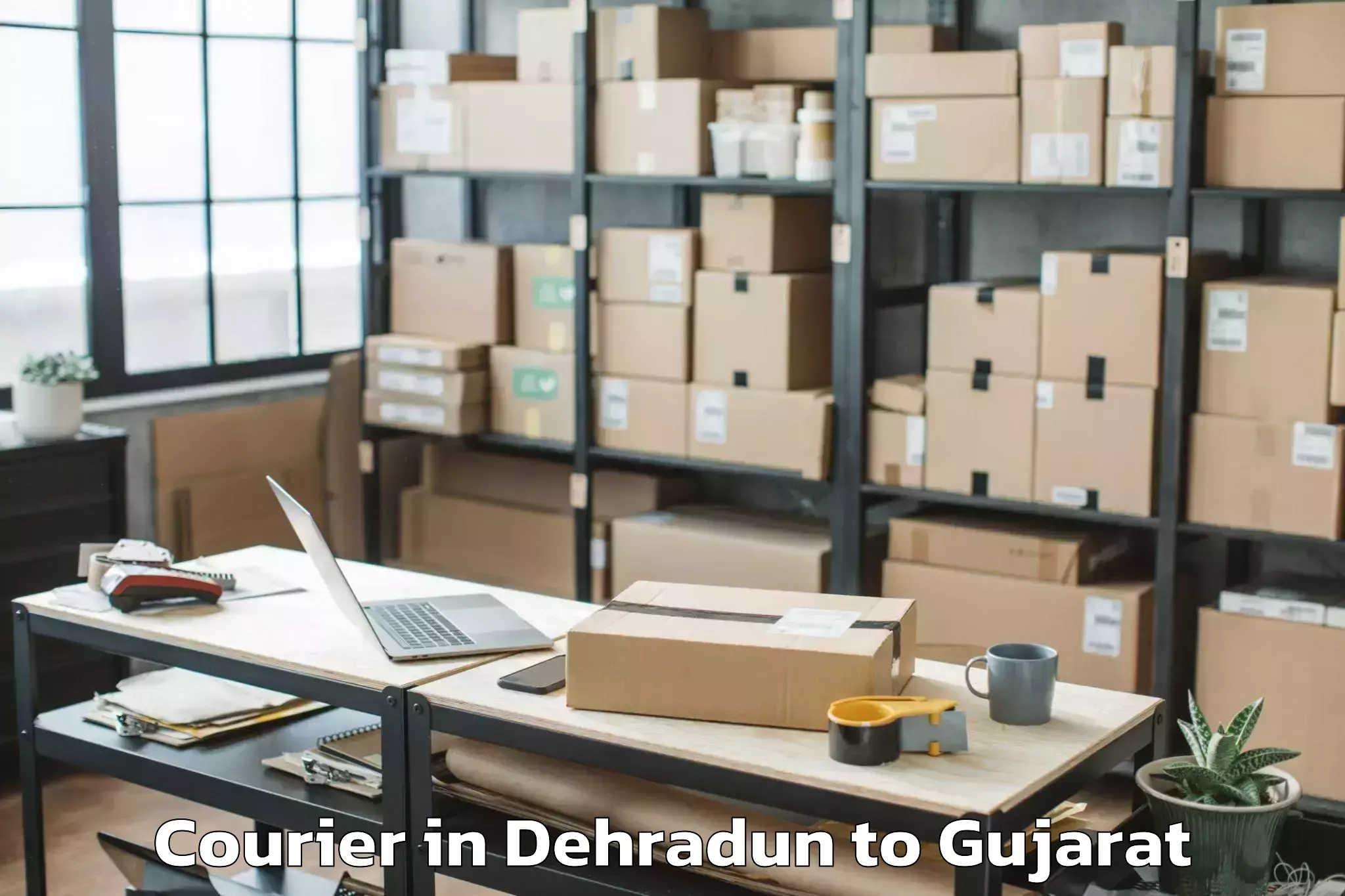 Easy Dehradun to Ahmedabad Airport Amd Courier Booking